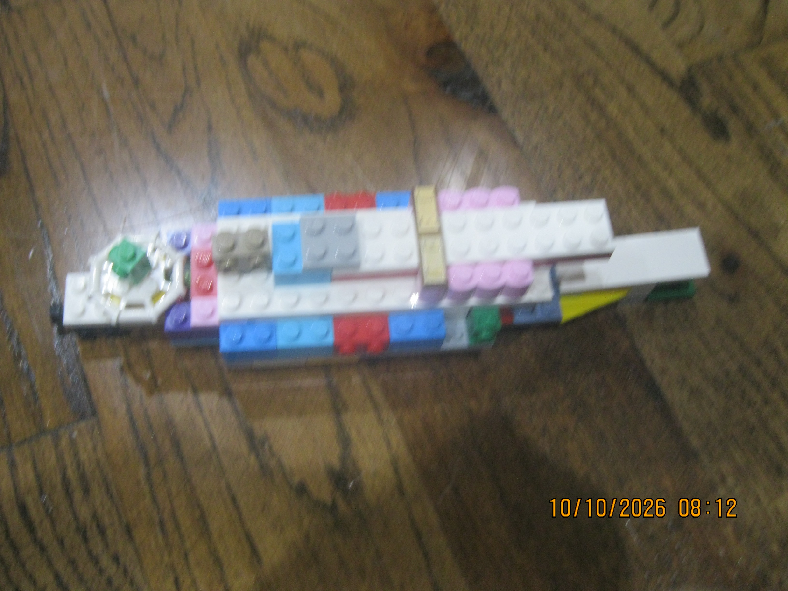 A colorful LEGO City light assault battleship